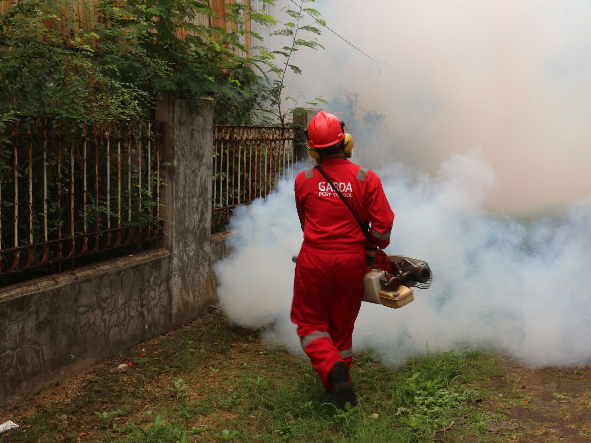 pest control person killing bugs