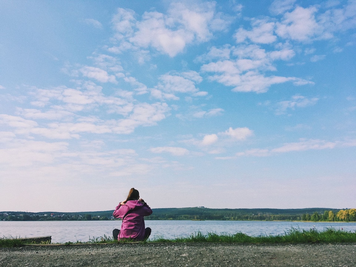 woman sitting alone on a beach