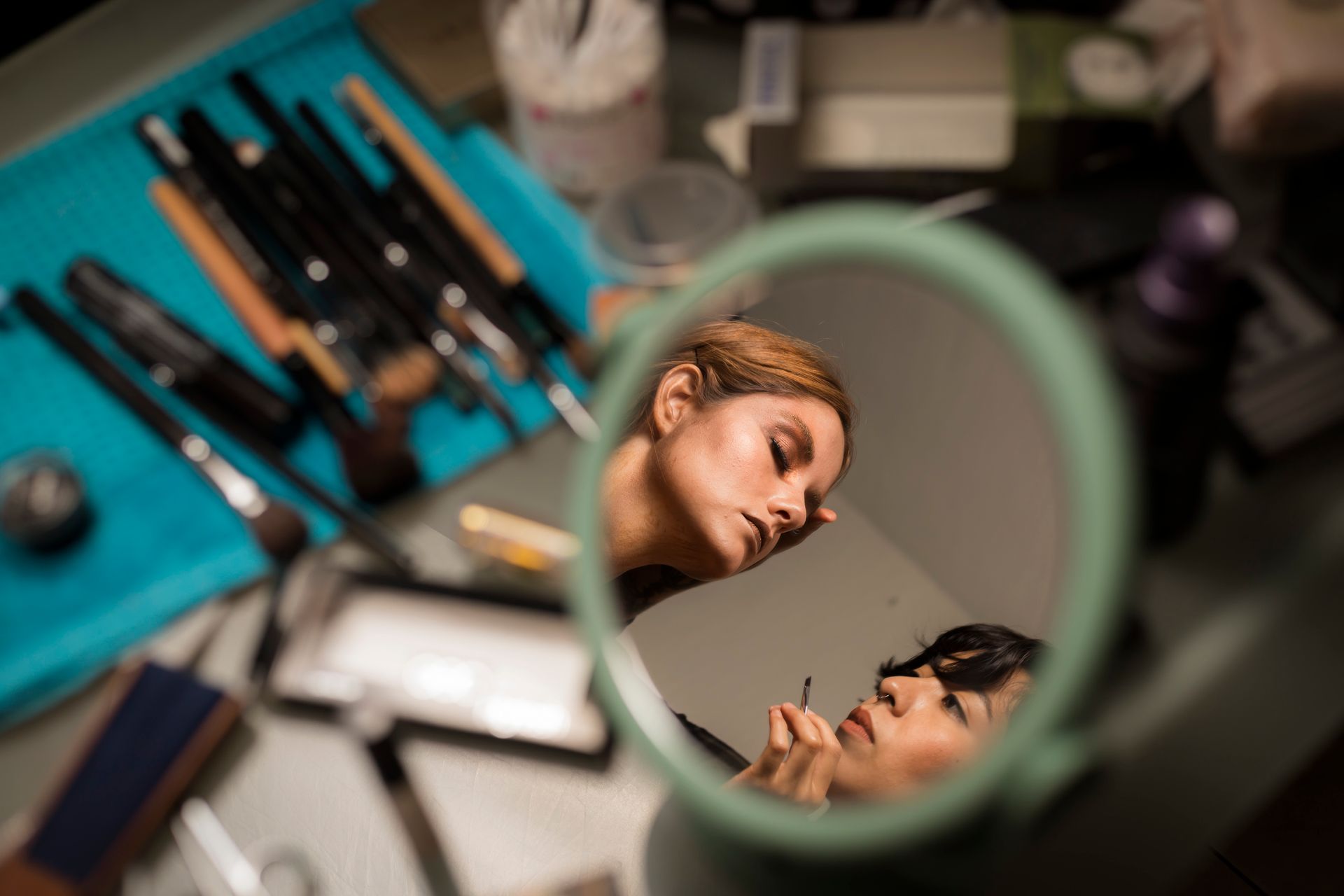 makeup artist styling a client
