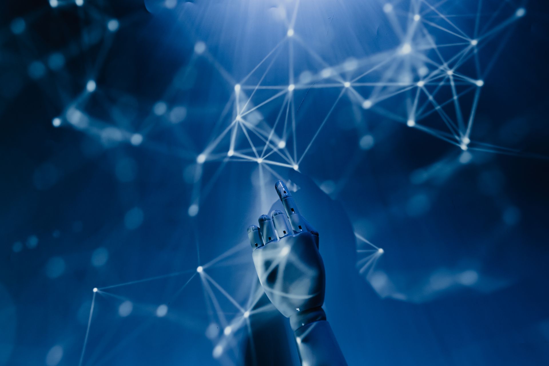 a robotic hand reaching into a digital network