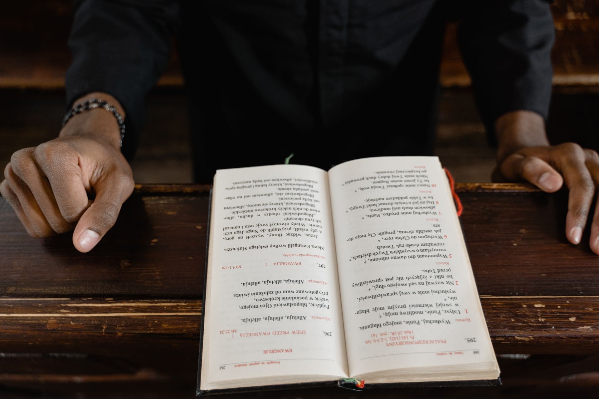 priest reading from a bible