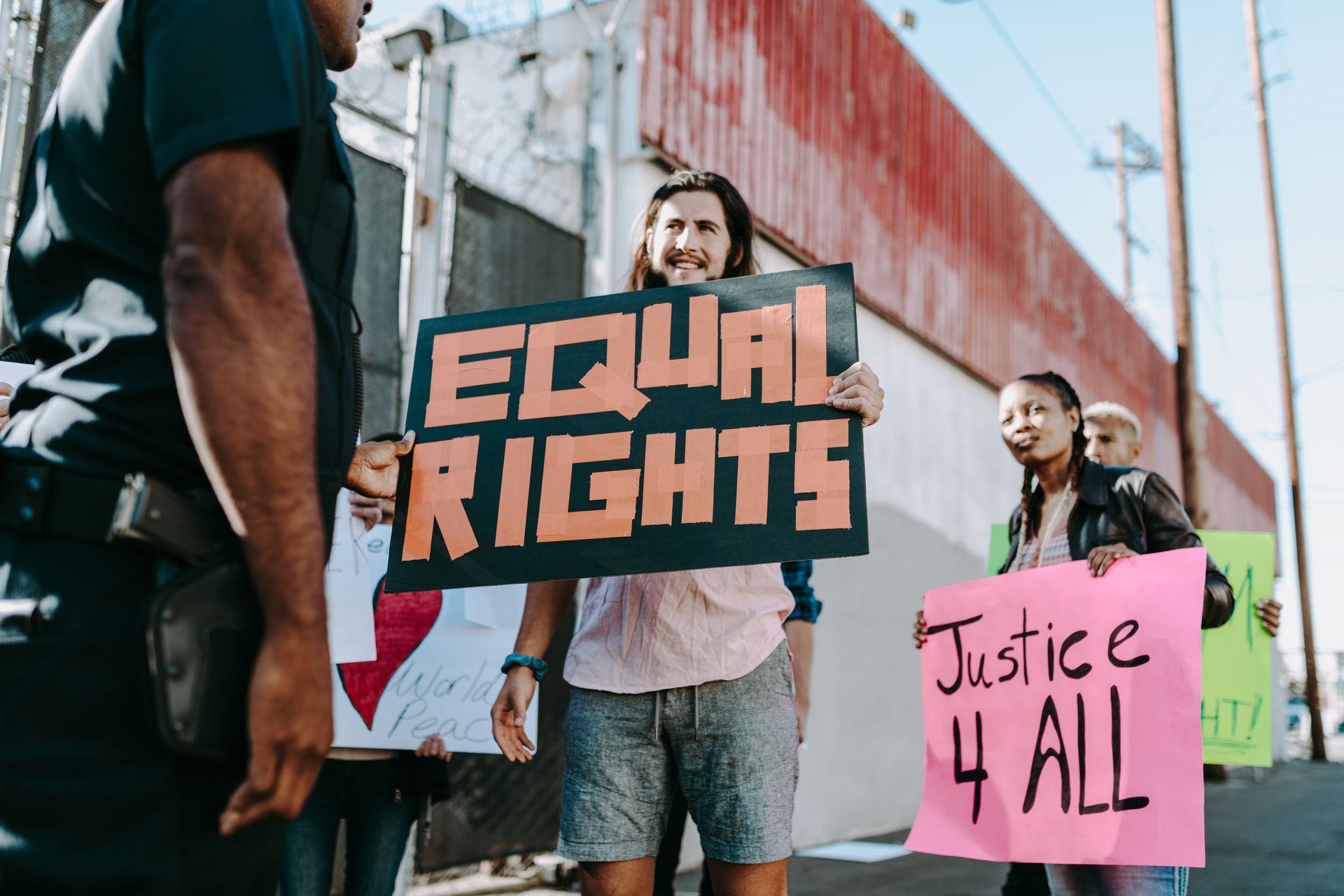 a group of people holding signs at a protest for racial justice
