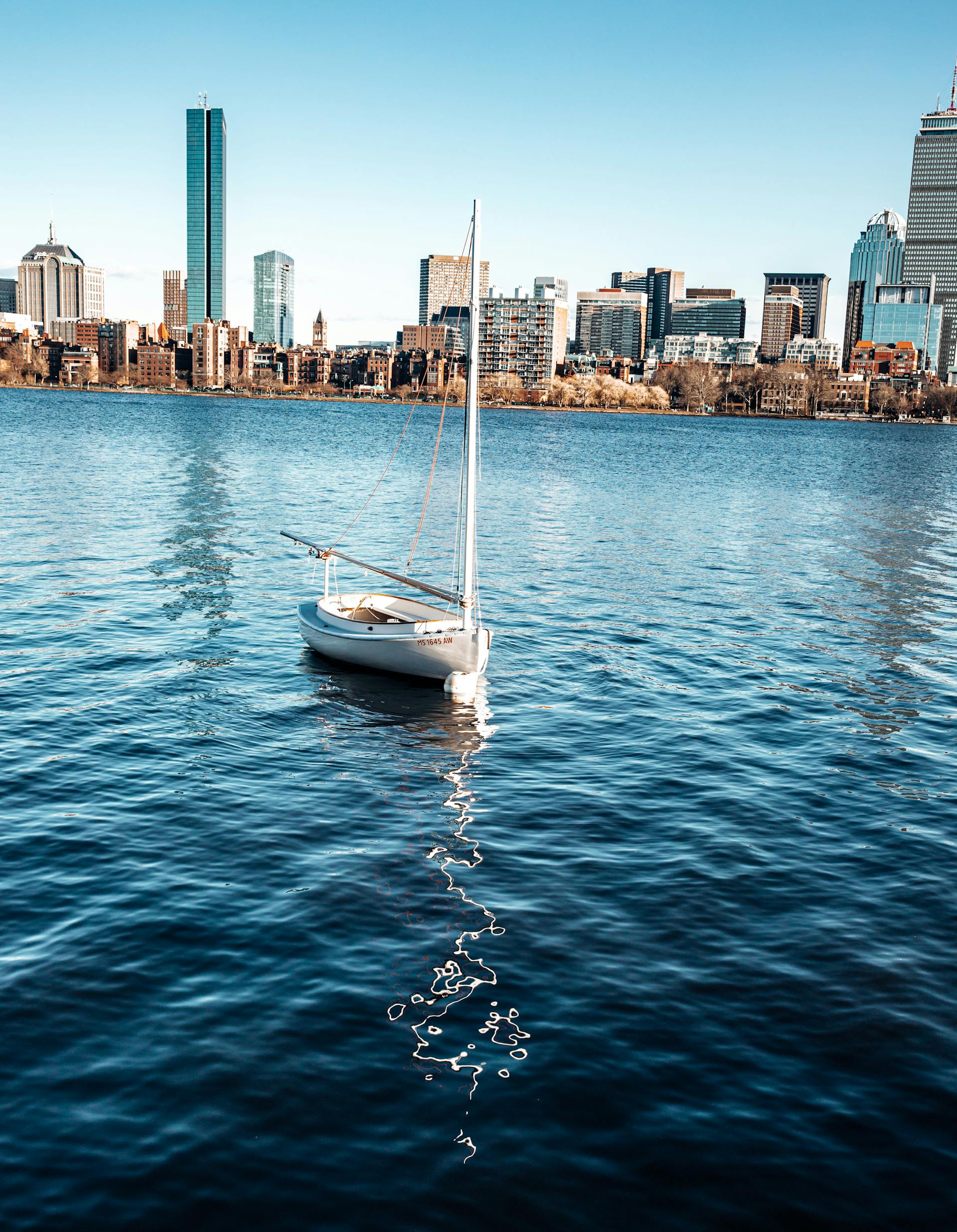 sailboat anchored on charles river