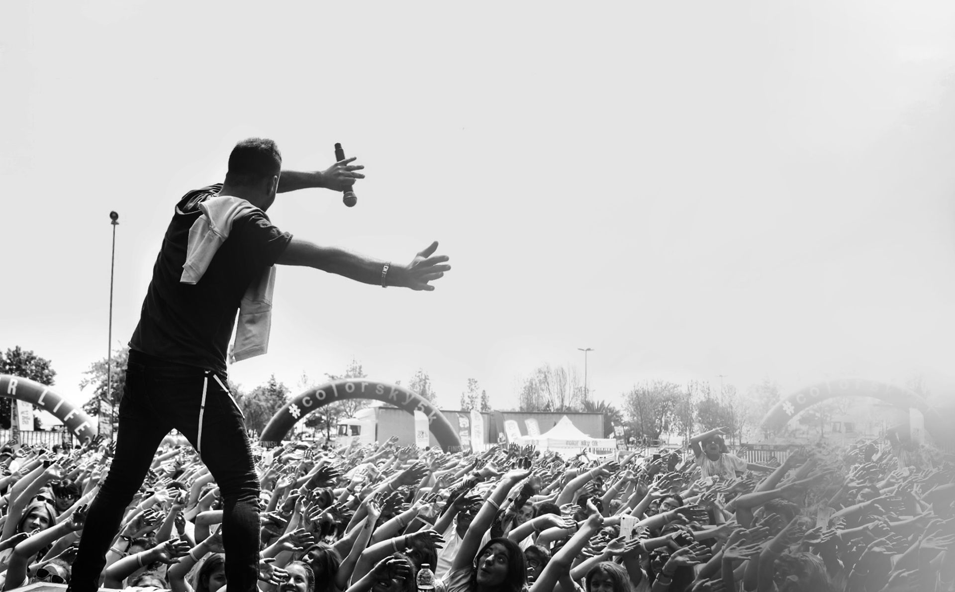 singer performing at a concert in front of fans