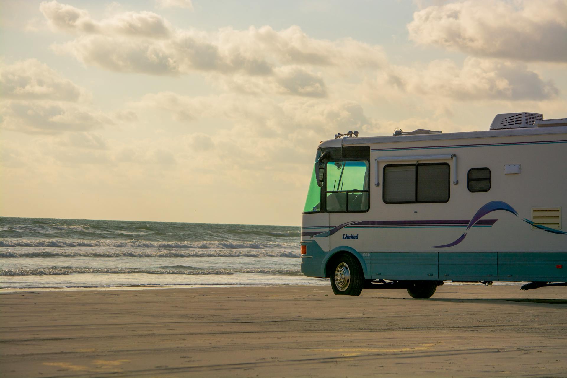 rv parked on a beach