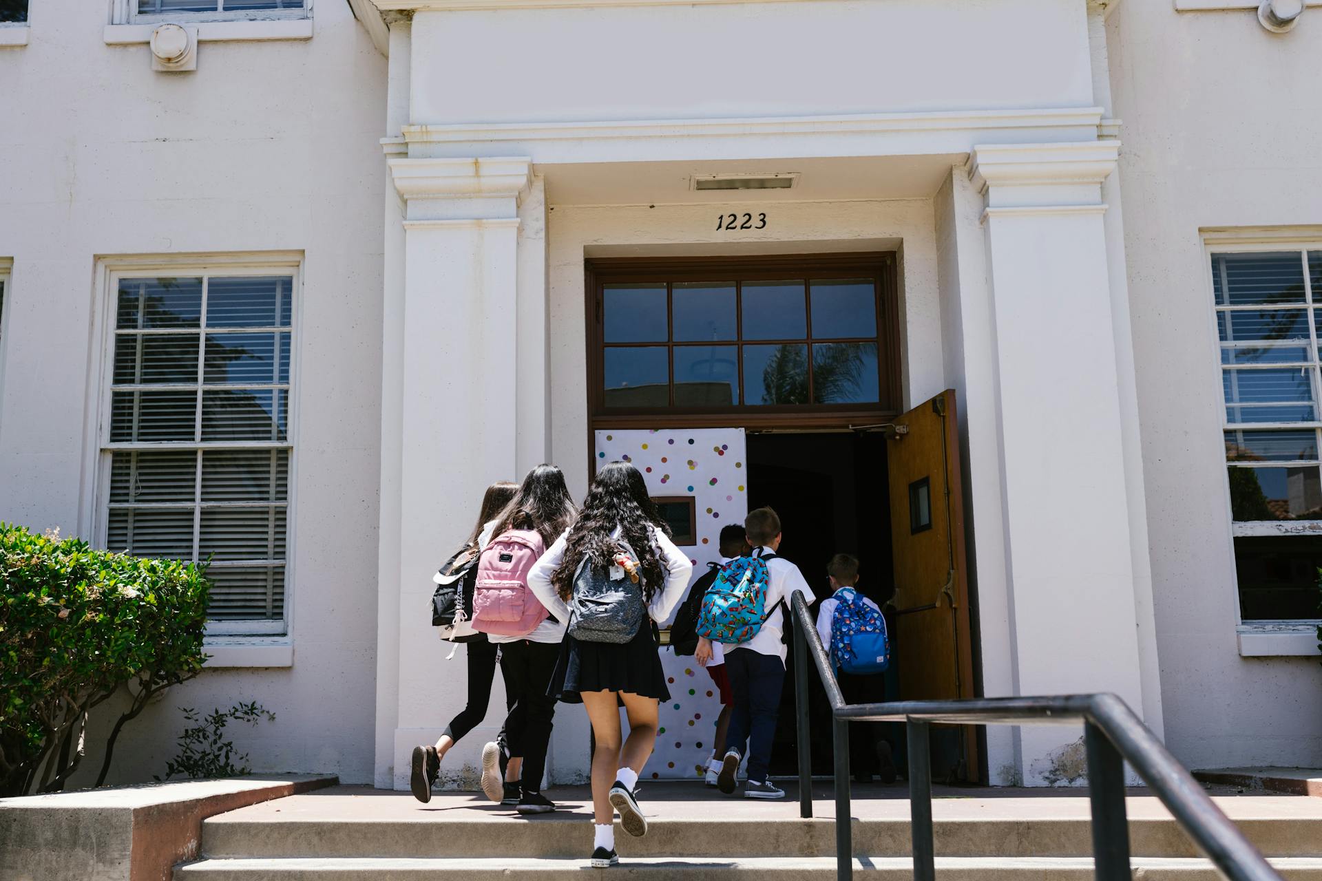 kids going inside a school