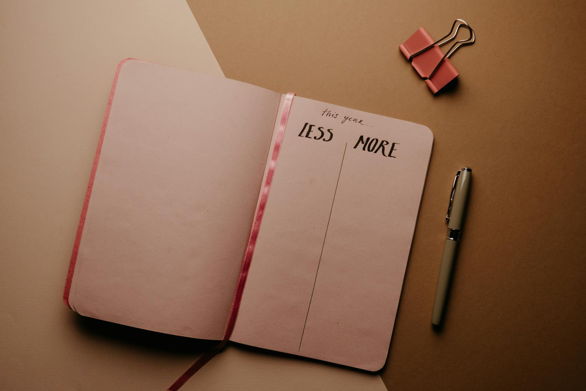 pink notebook on a table