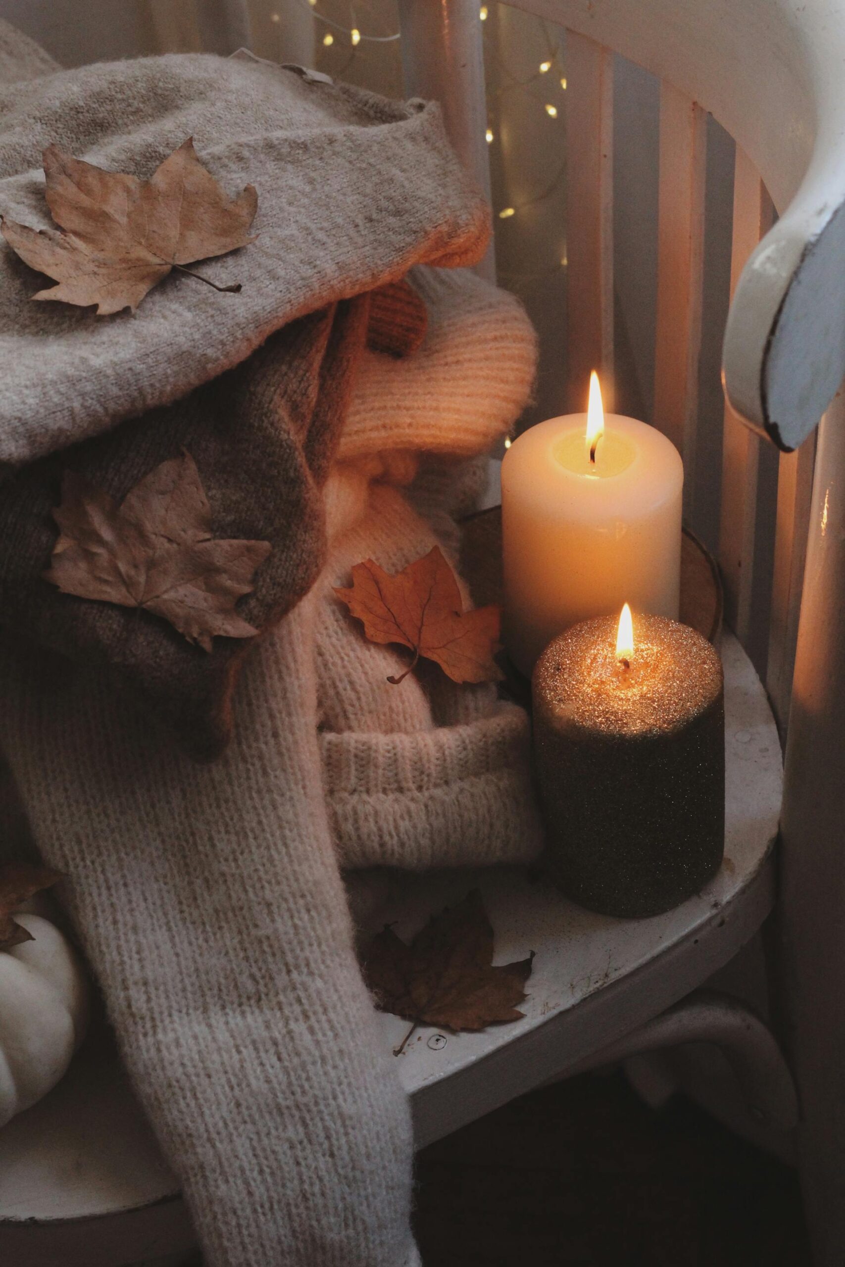 cozy candles on a wooden chair
