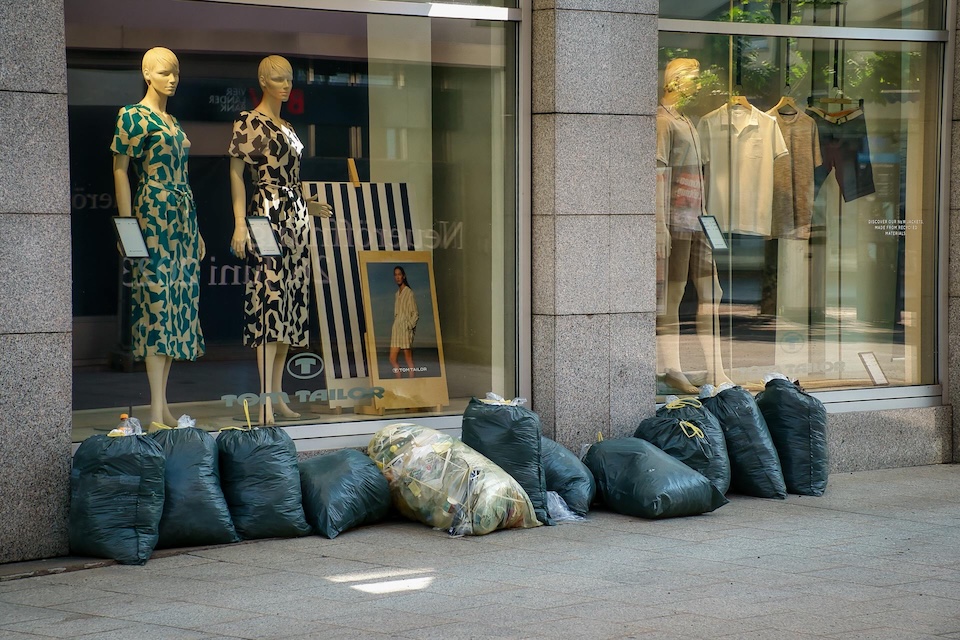 trash bags outside a window display