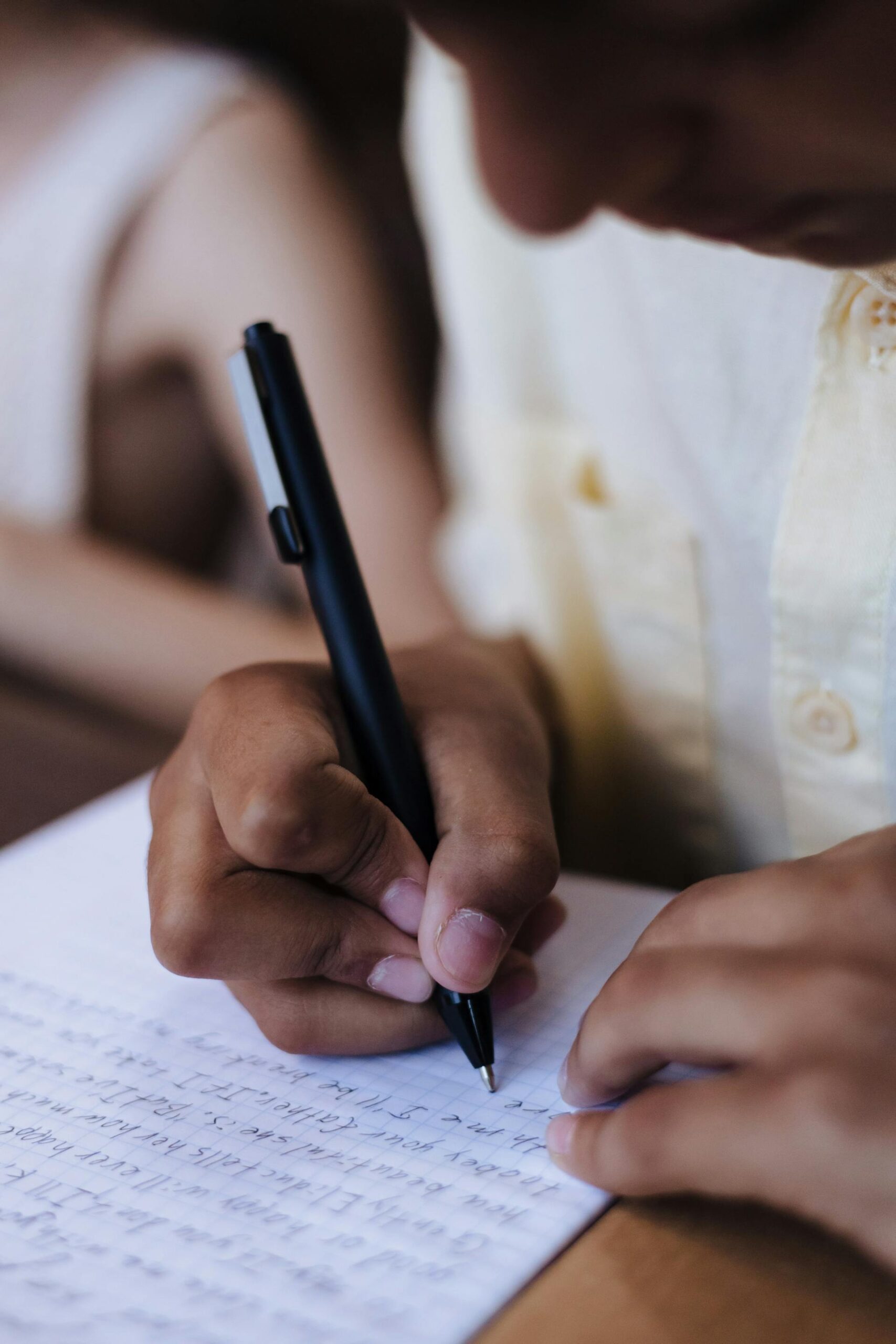 close up of a person writing consistently