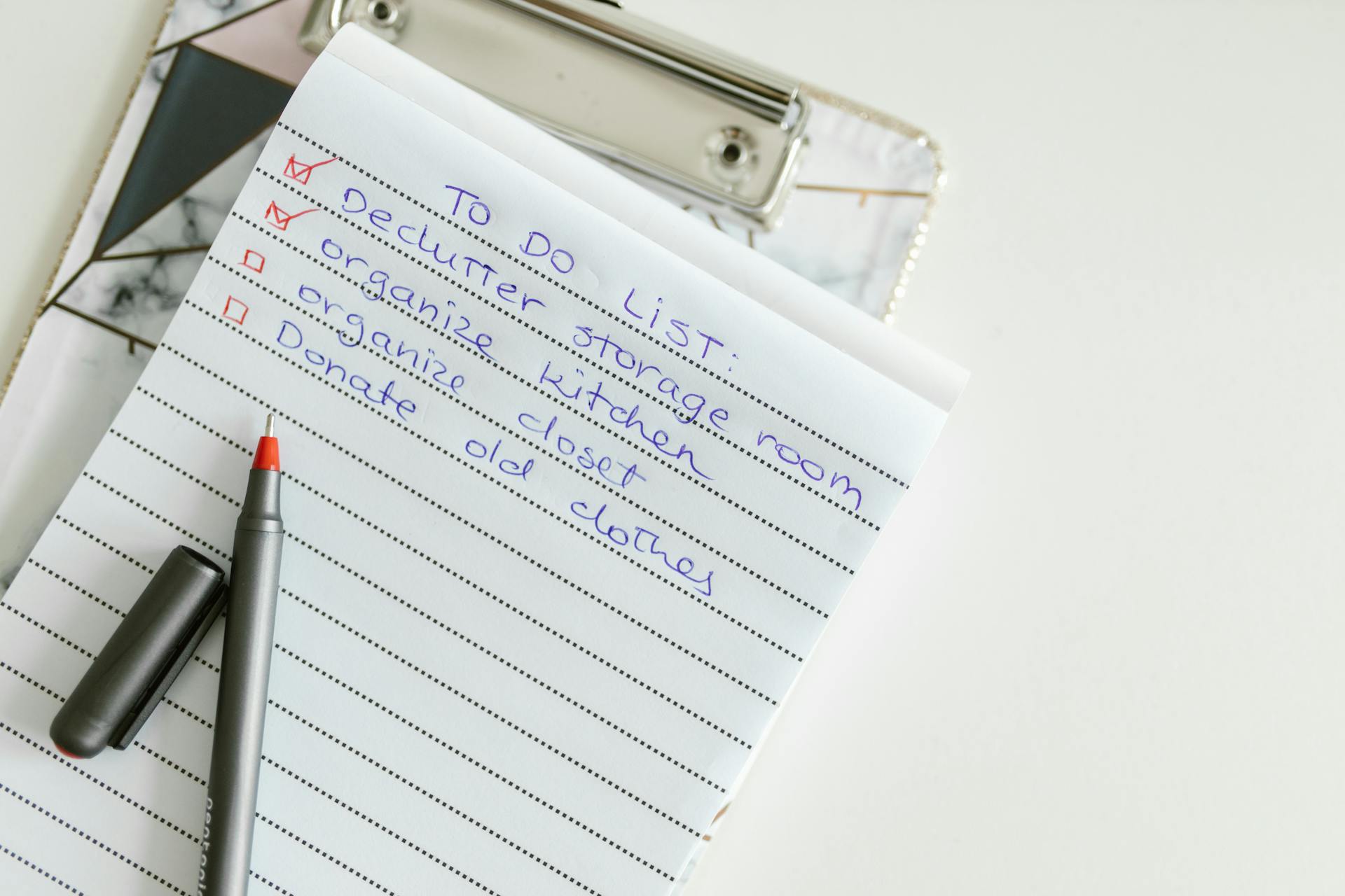 decluttering list written on a notepad