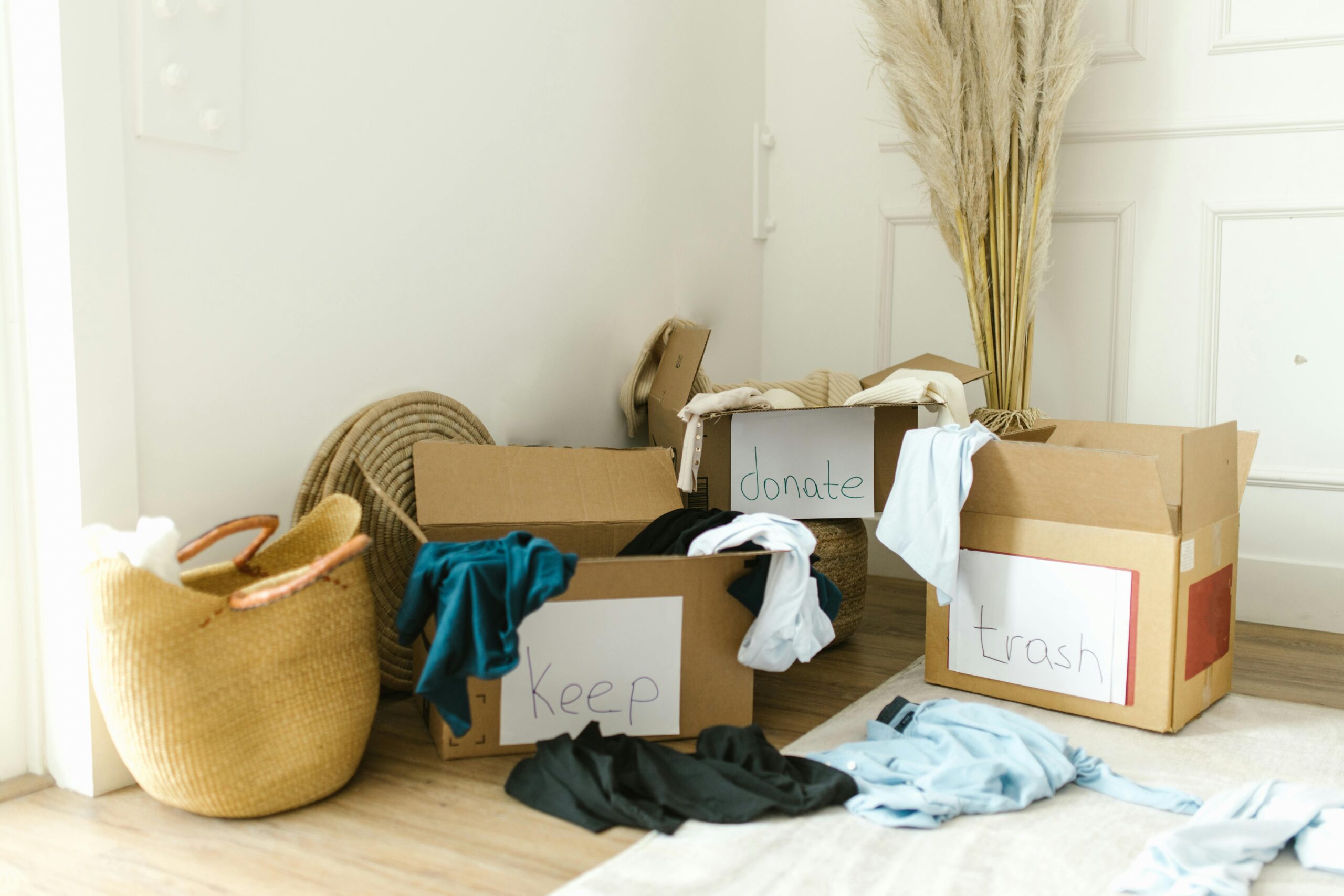 Decluttering boxes filled with items to donate — start your decluttering journey with these 15 life-changing decluttering projects for a more minimal, intentional home.